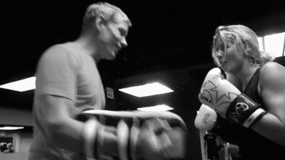 Man And Woman Boxing In Gym With Everlast Gloves GIF