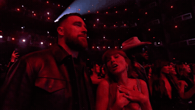 Man And Woman Clapping Before Crowd GIF