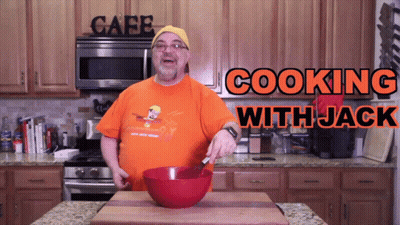Man And Woman Cooking In Kitchen With Fire Dept Shirt GIF
