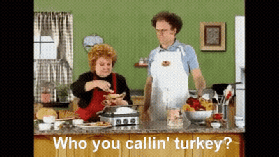 Man And Woman Cooking Who You Callin Turkey GIF