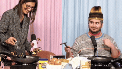 Man And Woman Cooking With Arc Spatula GIF