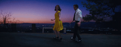 Man And Woman Dancing At Sunset City GIF