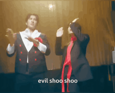 Man And Woman Dancing Evil Shoo Shoo GIF