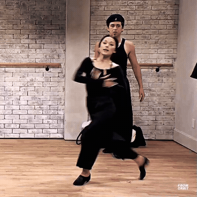 Man And Woman Dancing In Brick Studio GIF