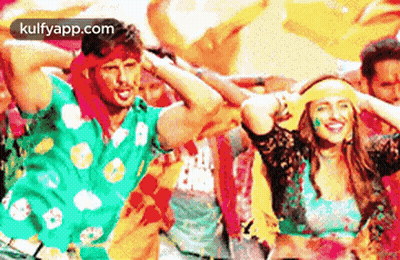 Man And Woman Dancing In Colored Powder GIF