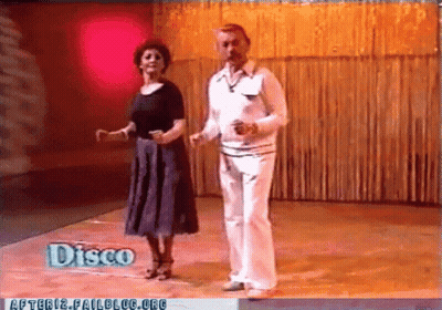 Man And Woman Dancing In Disco GIF