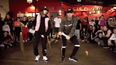 Man And Woman Dancing In Front Of Crowd GIF
