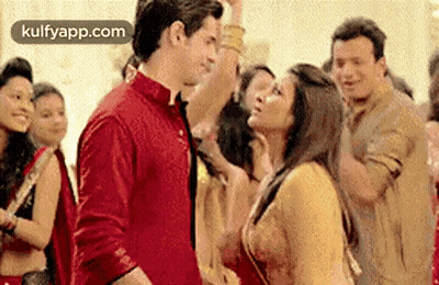 Man And Woman Dancing In Front Of Crowd GIF