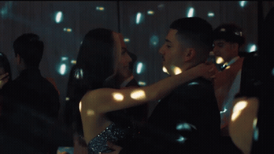 Man and Woman Dancing in Front of Disco Ball