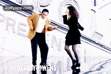 Man And Woman Dancing In Front Of Geoffrey Owens GIF