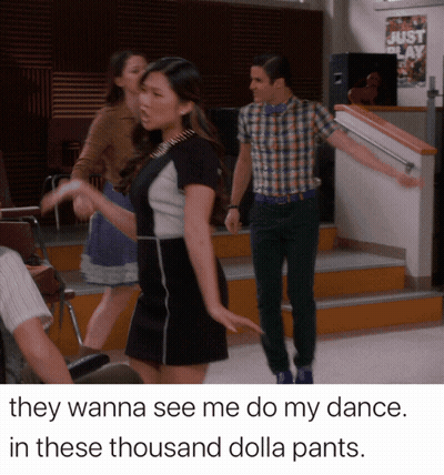 Man And Woman Dancing In Front Of Just Play Sign GIF