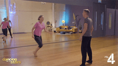 Man And Woman Dancing In Front Of Mirror GIF