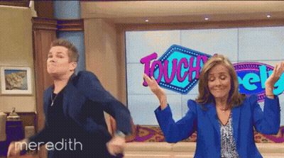 Man and Woman Dancing in Front of Touch Sign