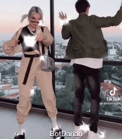 Man And Woman Dancing In Front Of Window GIF