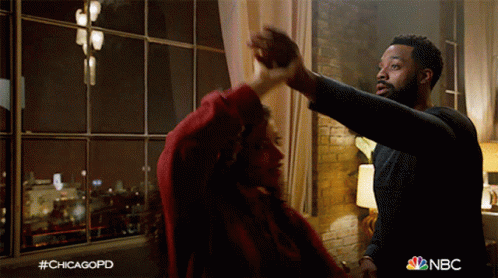 Man And Woman Dancing In Front Of Window NBC GIF