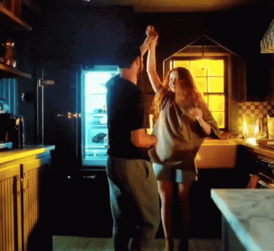 Man And Woman Dancing In Kitchen GIF