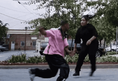 Man And Woman Dancing In Parking Lot GIF