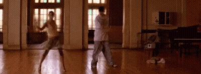Man And Woman Dancing In Room With Piano GIF