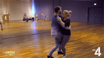 Man And Woman Dancing In Studio With Dancing Stars GIF