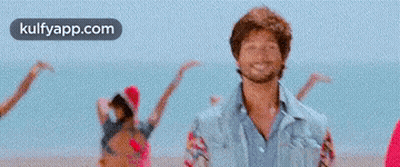 Man And Woman Dancing On Beach GIF