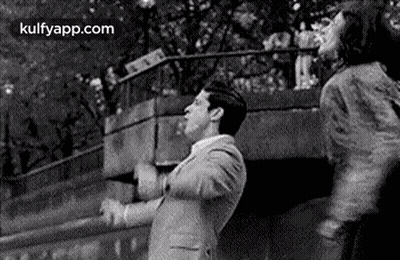 Man And Woman Dancing On Bridge GIF
