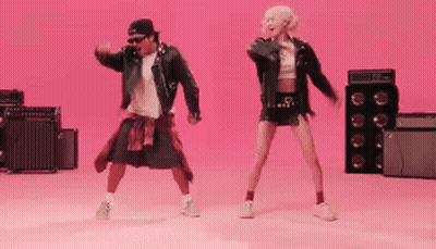 Man And Woman Dancing On Pink GIF