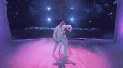 Man And Woman Dancing On Purple Dance Floor GIF