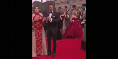 Man And Woman Dancing On Red Carpet GIF