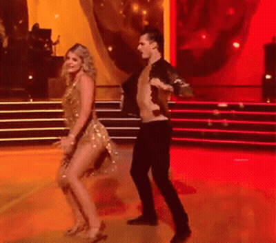 Man and Woman Dancing on Red Carpet