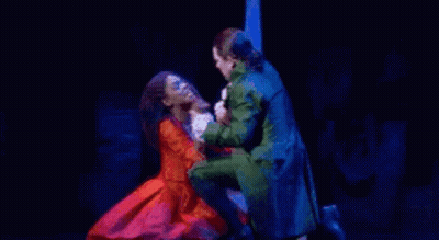 Man And Woman Dancing On Stage In Musical GIF