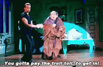 Man And Woman Dancing On Stage Saying You Gotta Pay The Troll Toll GIF