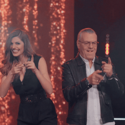 Man And Woman Dancing On Stage Smiling GIF
