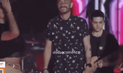 Man And Woman Dancing On Stage With Band GIF