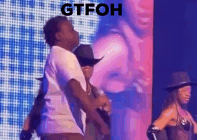 Man And Woman Dancing On Stage With Mic GIF