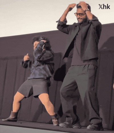 Man And Woman Dancing On Stage With XHK GIF
