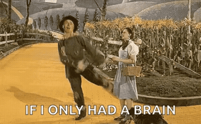 Man And Woman Dancing On Yellow Brick Road GIF