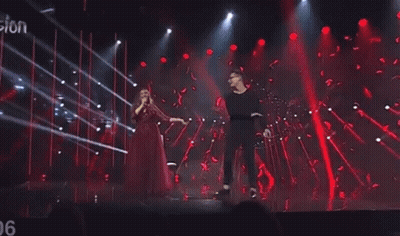 Man And Woman Dancing Singing On Stage GIF