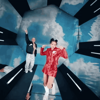 Man And Woman Dancing Under Blue Sky GIF
