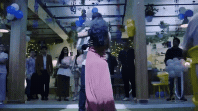 Man And Woman Dancing With Balloons GIF