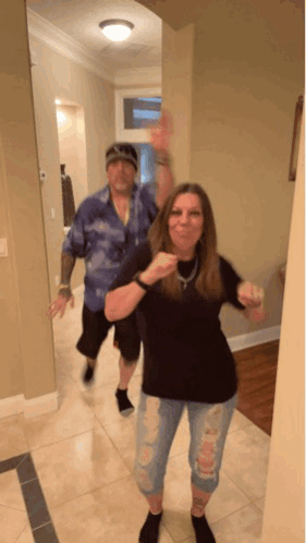Man And Woman Dancing Woman Pointing At Camera GIF