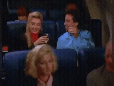Man And Woman Drinking Beer On Airplane GIF