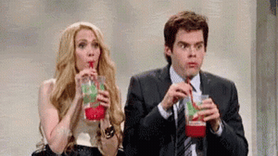 Man And Woman Drinking From Straws GIF