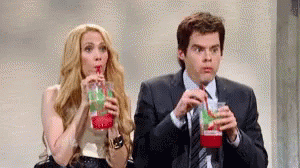 Man And Woman Drinking Through Straws GIF