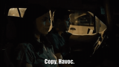 Man and Woman Driving at Night Saying Copy Havoc
