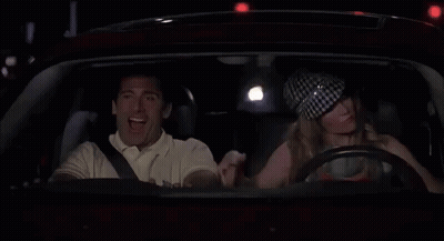 Man And Woman Driving At Night Woman Flexing Muscles GIF
