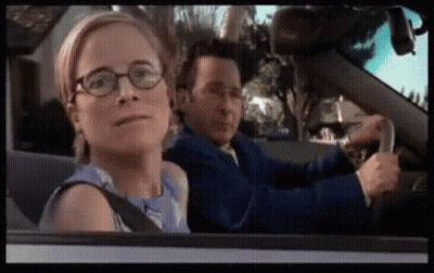 Man And Woman Driving Car, Woman Wearing Glasses GIF