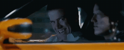 Man And Woman Driving Yellow Car GIF