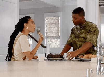 Man And Woman Eating At Kitchen Table GIF