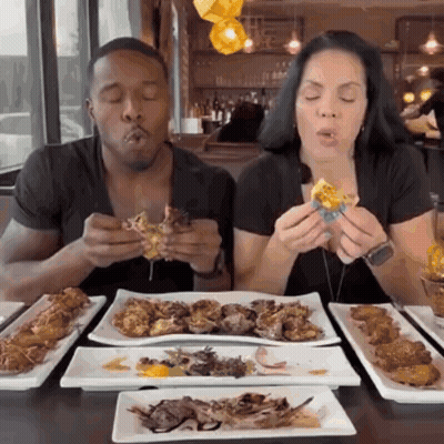 Man And Woman Eating At Table GIF