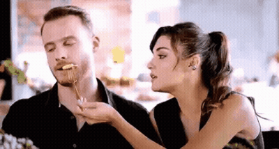 Man And Woman Eating At Table GIF